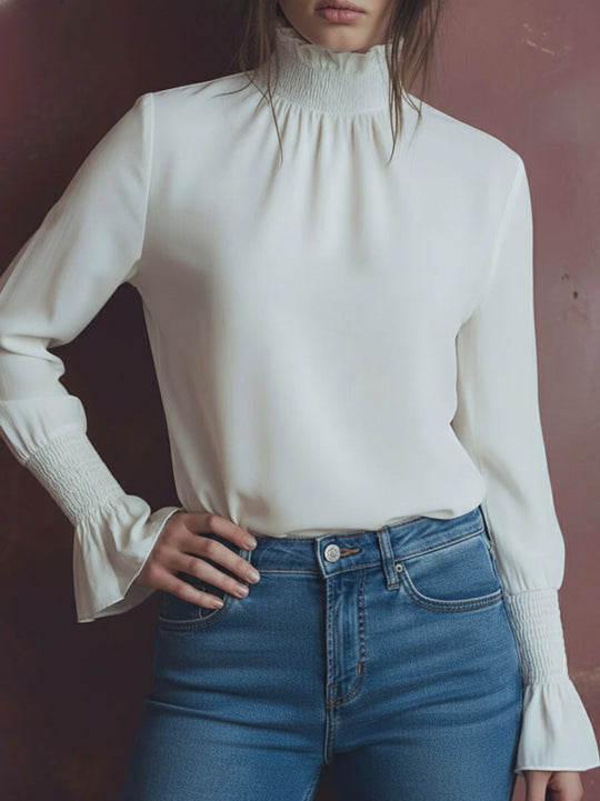Elegant High Neck White Blouse With Smocked Cuffs And Ruffle Details